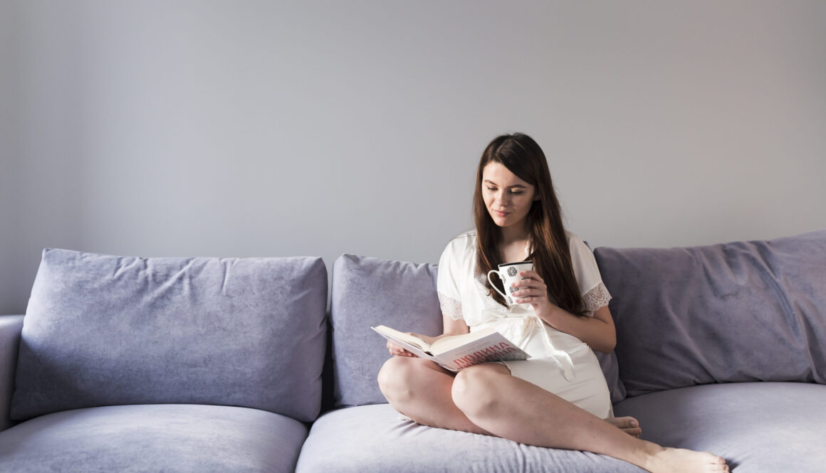 woman-reading-book-couch