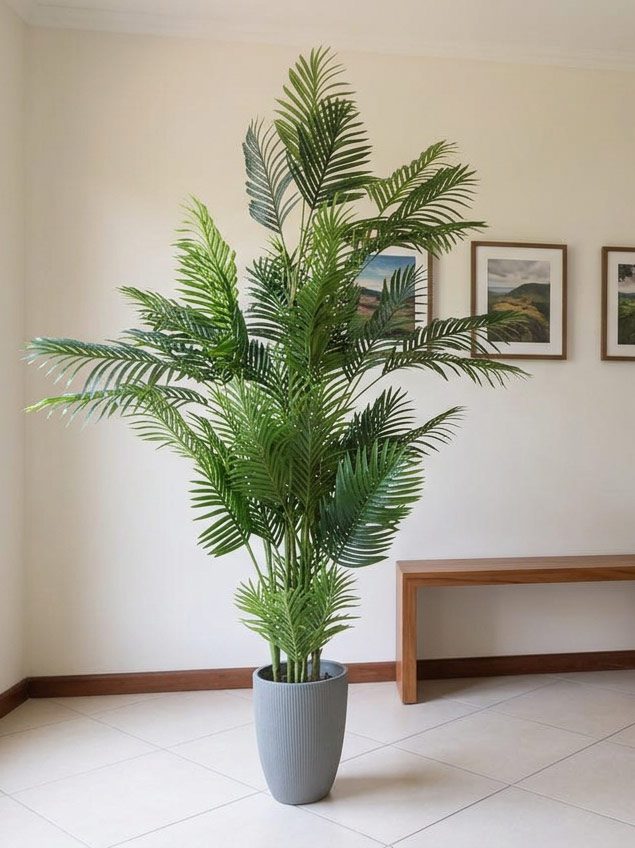 Realistic artificial plant collection styled across a Jacó condo interior — Riviera Home Furniture